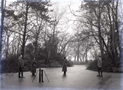 Glass negative of Baker family skating on pond at Beaconfield