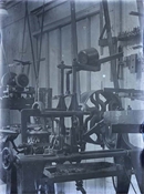 Glass negative of workshop and machinery at Beaconfield