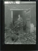 Print from glass negative, Margaret Baker in garden.