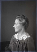 Glass negative of one of ladies of Baker family.