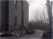 Glass negative of a corner of Beaconfield House