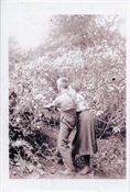 Photograph, modern print, of Baker family members in garden.