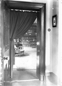 Glass negative of view into room at Epworth House.