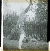 Glass plate of man doing handstand