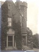 Glass negative showing part of Beaconfield House exterior.