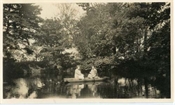 Photograph of pond with punt at Beaconfield.
